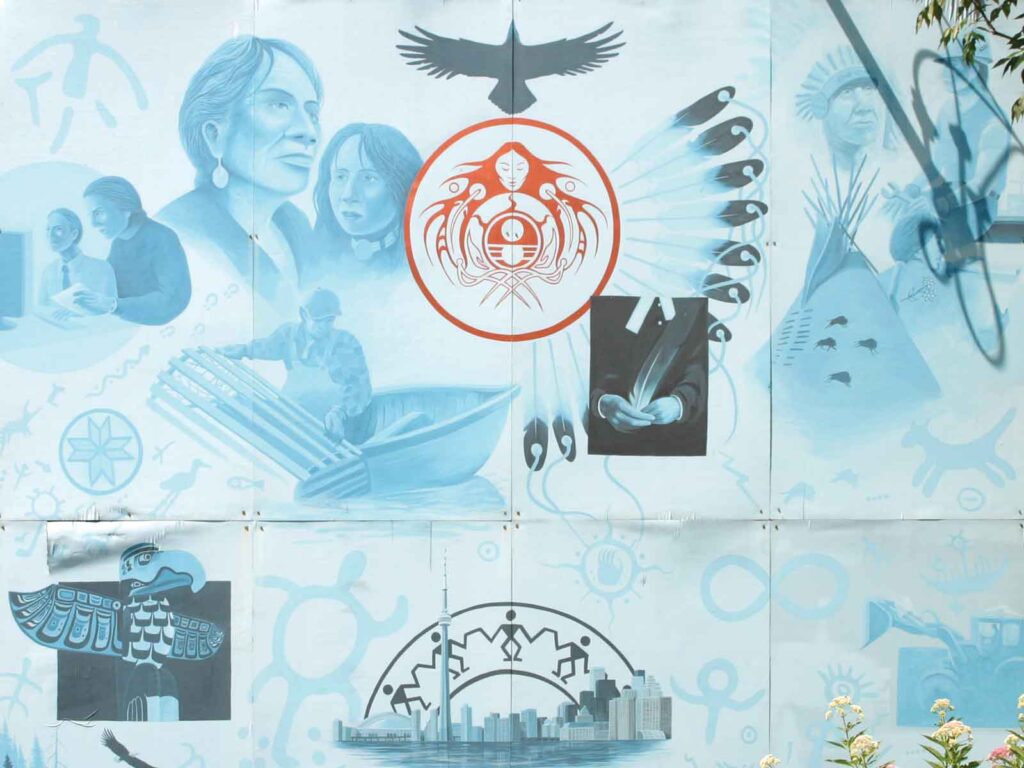 A blue mural representing Indigenous accomplishments over the years.